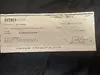Scam artist buying jewelry with fake check